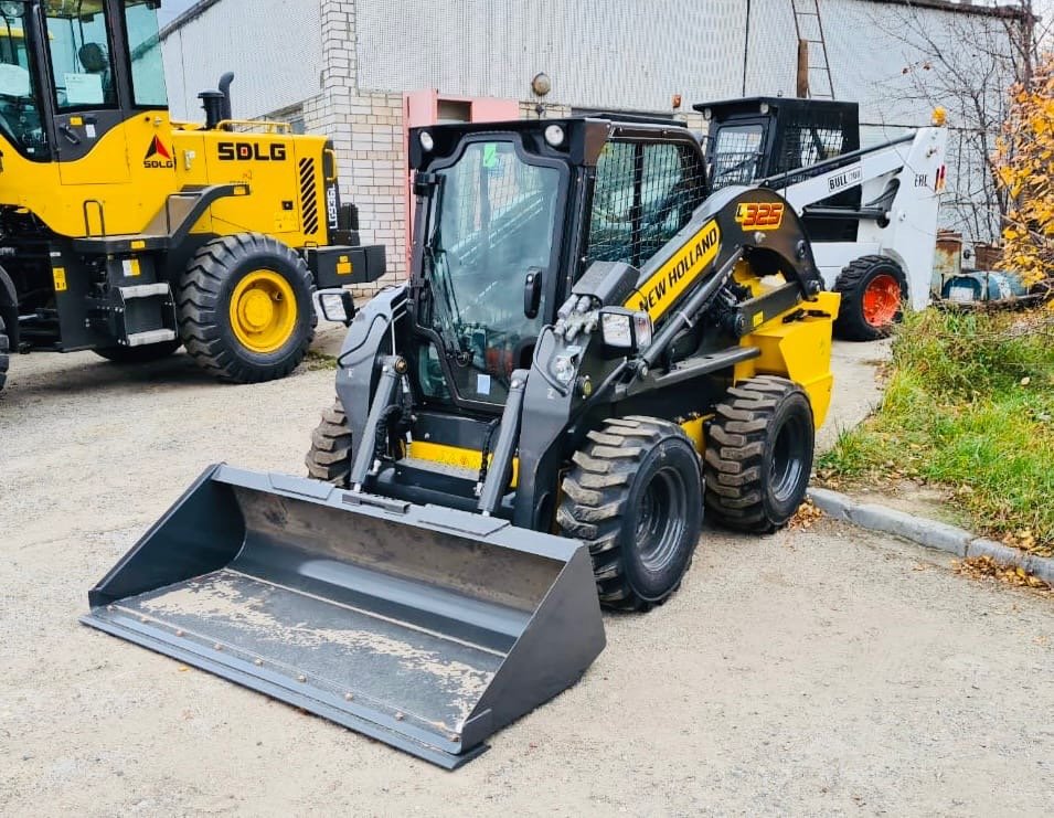 Аренда мини - погрузчика New Holland L325
