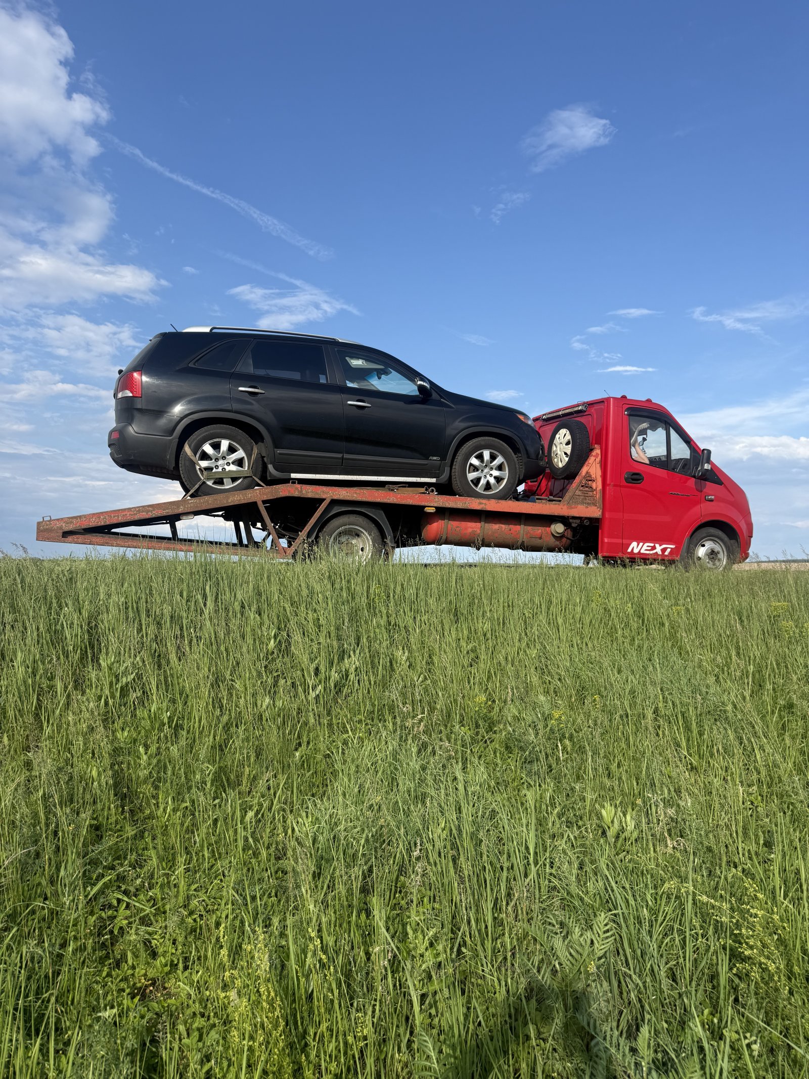 Услуги эвакуатора с автосервисом и шиномонтажом