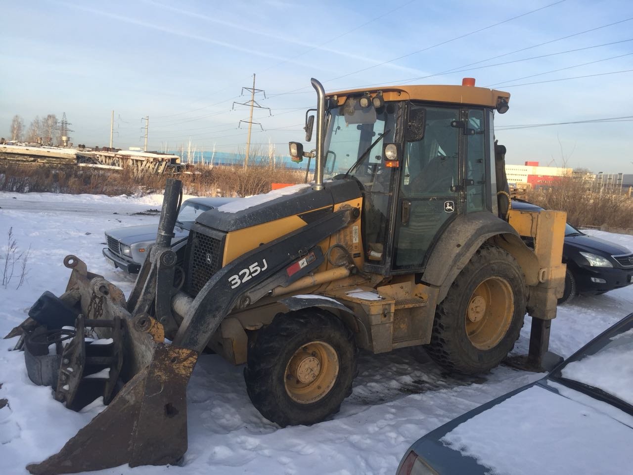 Аренда экскаватора-погрузчика John Deere 325J