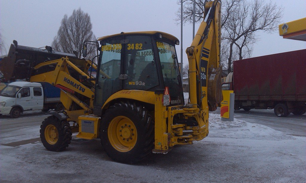 Аренда New Holland B115 для планировки и уборки территории