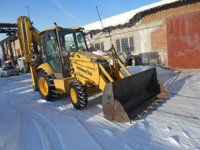 Услуги экскаватора-погрузчика KOMATSU